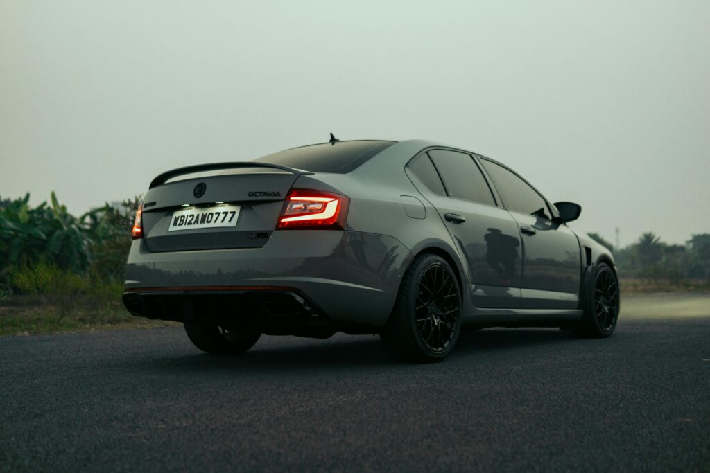 Modern grey Skoda Octavia parked on a serene Indian road, showcasing its sleek design and style.